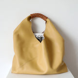 Spliced woven shoulder bag